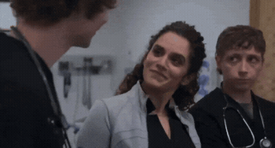 Group Of Doctors Talking In Room GIF