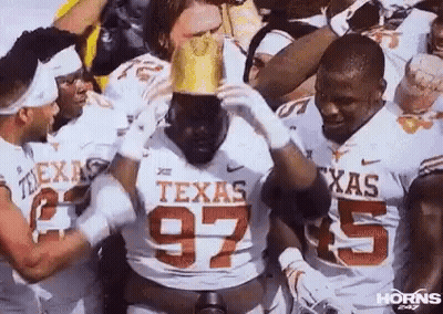 Group Of Football Players Holding Crown On Head GIF