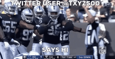 Group Of Football Players Standing On Field GIF