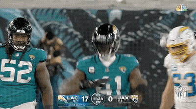 Group Of Football Players Standing On Field GIF