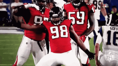 Group Of Football Players Standing On Field GIF
