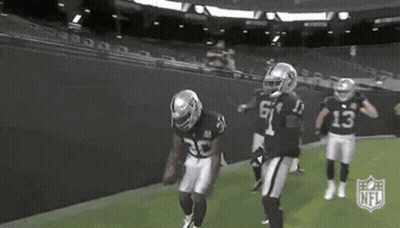 Group Of Football Players Standing On Field GIF