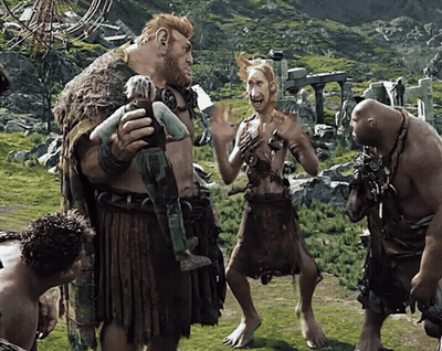 Group Of Giants Standing In Grassy Area GIF