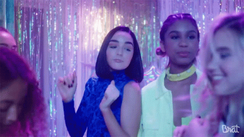 Group Of Girls Dancing In Room With Purple Lights And Brat GIF