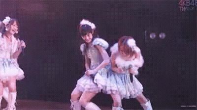 Group Of Girls Dancing On Stage With Microphones GIF