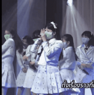 Group Of Girls In Face Masks On Stage GIF