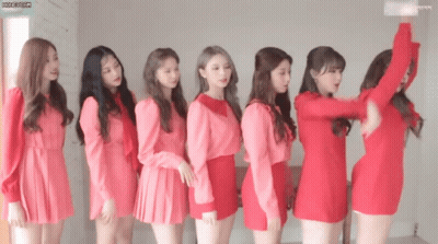 Group Of Girls In Red Dresses Standing In Line GIF