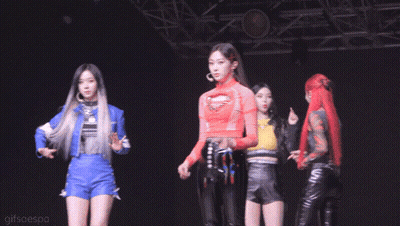 Group Of Girls On Stage With Man Between Them GIF