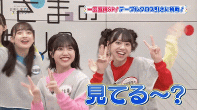 Group Of Girls Posing With Name Tag Saying ? GIF