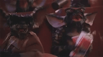 Group Of Gremlins Standing Together GIF