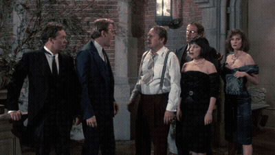 Group Of Men And Women Standing In Front Of Brick Wall GIF