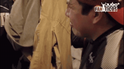 Group Of Men Around Microphone Wearing A Shirt GIF
