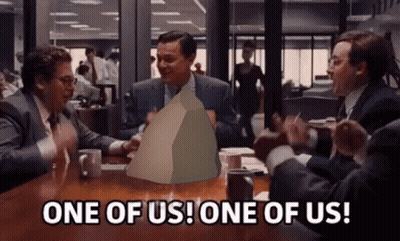 Group Of Men Around Table With One Holding Paper Saying One Of Us GIF