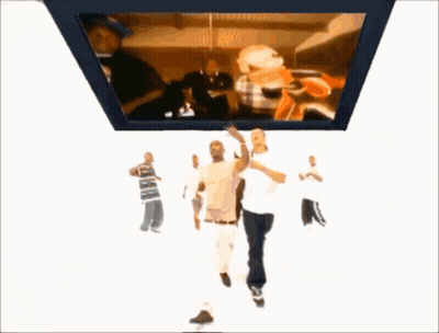 Group Of Men Dancing In Front Of Large Screen GIF