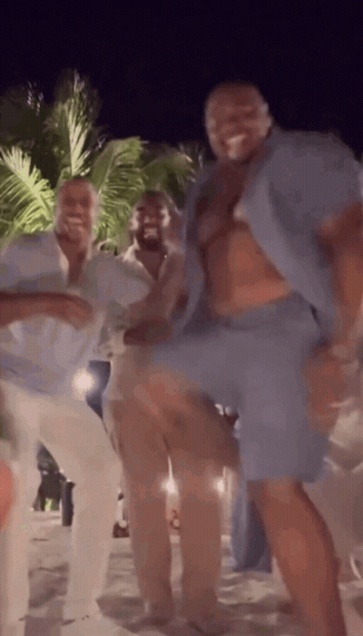Group Of Men Dancing On Beach At Night GIF