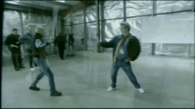 Group Of Men Fighting In Room GIF