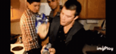 Group Of Men Holding Bottles In Kitchen GIF