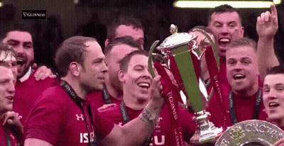 Group Of Men Holding Guinness Trophy GIF