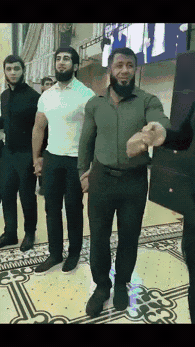 Group Of Men Holding Hands And Dancing GIF