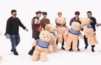 Group Of Men Holding Teddy Bears GIF