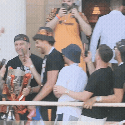 Group Of Men Holding Trophy Saying A GIF