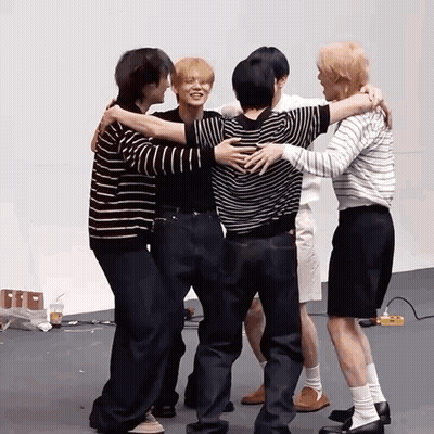 Group Of Men Hugging In Circle GIF