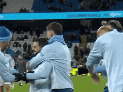 Group Of Men Hugging On Soccer Field Saying Documentaries GIF