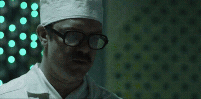 Group of Men in Dark Room Saying It's Pronounced Jiff