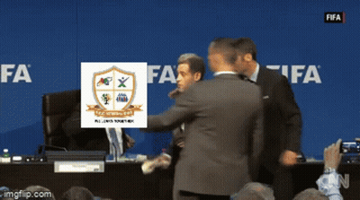 Group Of Men In Front Of Blue Wall Saying FIFA GIF
