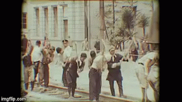 Group Of Men In Front Of Building GIF