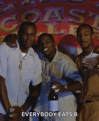 Group Of Men In Front Of Everybody Eats Sign GIF