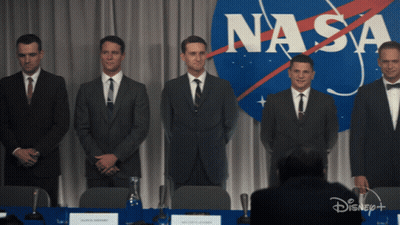 Group Of Men In Front Of NASA Logo GIF