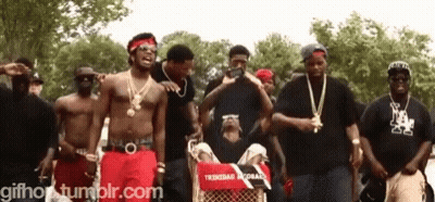 Group Of Men In Front Of Trinidad Record Cart GIF