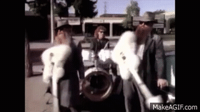 Group Of Men In Fur Coats On Street GIF