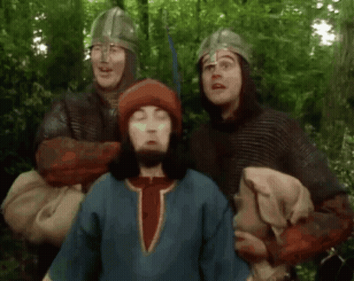 Group Of Men In Helmets Standing In Forest GIF