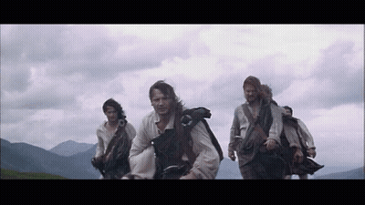 Group Of Men In Kilts Walking In Line GIF