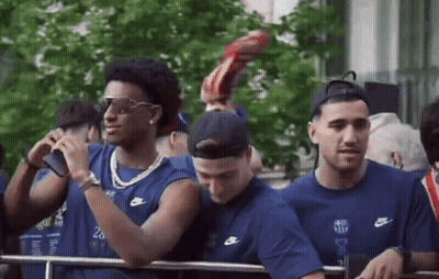 Group Of Men In Nike Shirts Standing In Line GIF
