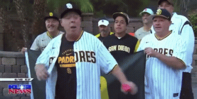 Group Of Men In Padres Jerseys In Front Of Brick Wall GIF