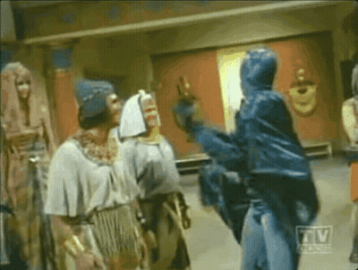 Group Of Men In Room With TV Logo GIF