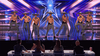 Group of Men in Sombrero Hats Dancing on Stage
