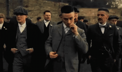 Group Of Men In Suits And Hats Walking GIF
