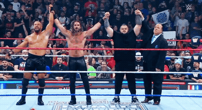 Group Of Men In Wrestling Ring With Wwe Sign GIF