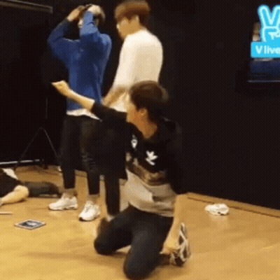 Group Of Men Kneeling In Room GIF