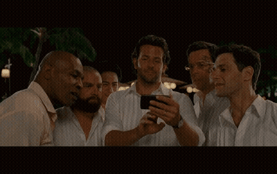 Group Of Men Looking At Phone Together GIF