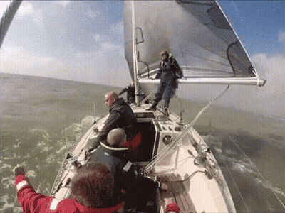 Group Of Men On A Sailboat GIF