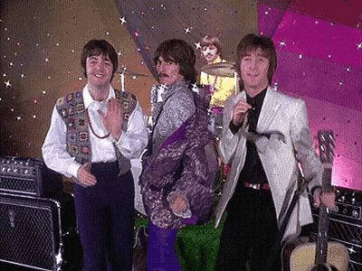 Group Of Men On Stage One Holding Guitar GIF
