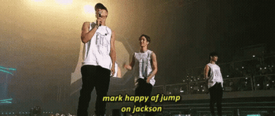 Group Of Men On Stage One Holding Microphone GIF