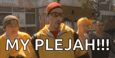 Group Of Men On Street One Wearing Sunglasses And Hat GIF