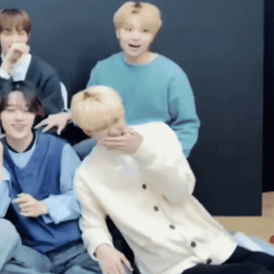 Group Of Men One Holding Another In Arms GIF
