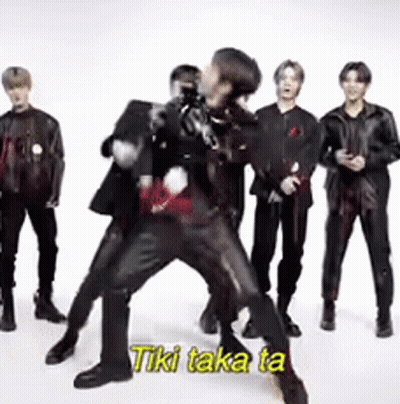 Group Of Men One Holding Another In Arms GIF